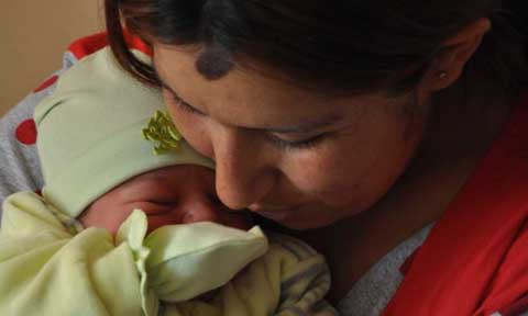 A mother and a newborn baby girl at the maternity hospital in Talin. Photo by Nune Hayrapetyan